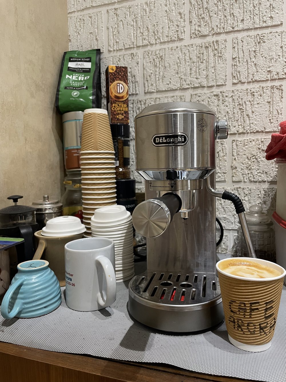Sahej's espresso machine and a cup of coffee at home