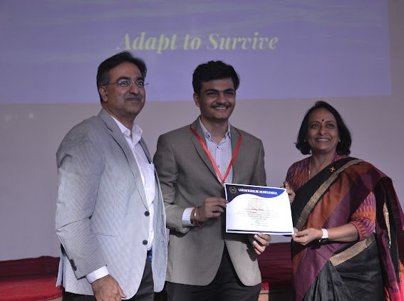 Sahej receiving a certificate on stage