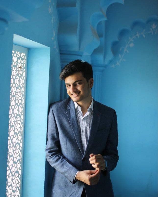 Sahej Arora, smiling, in a blue jacket